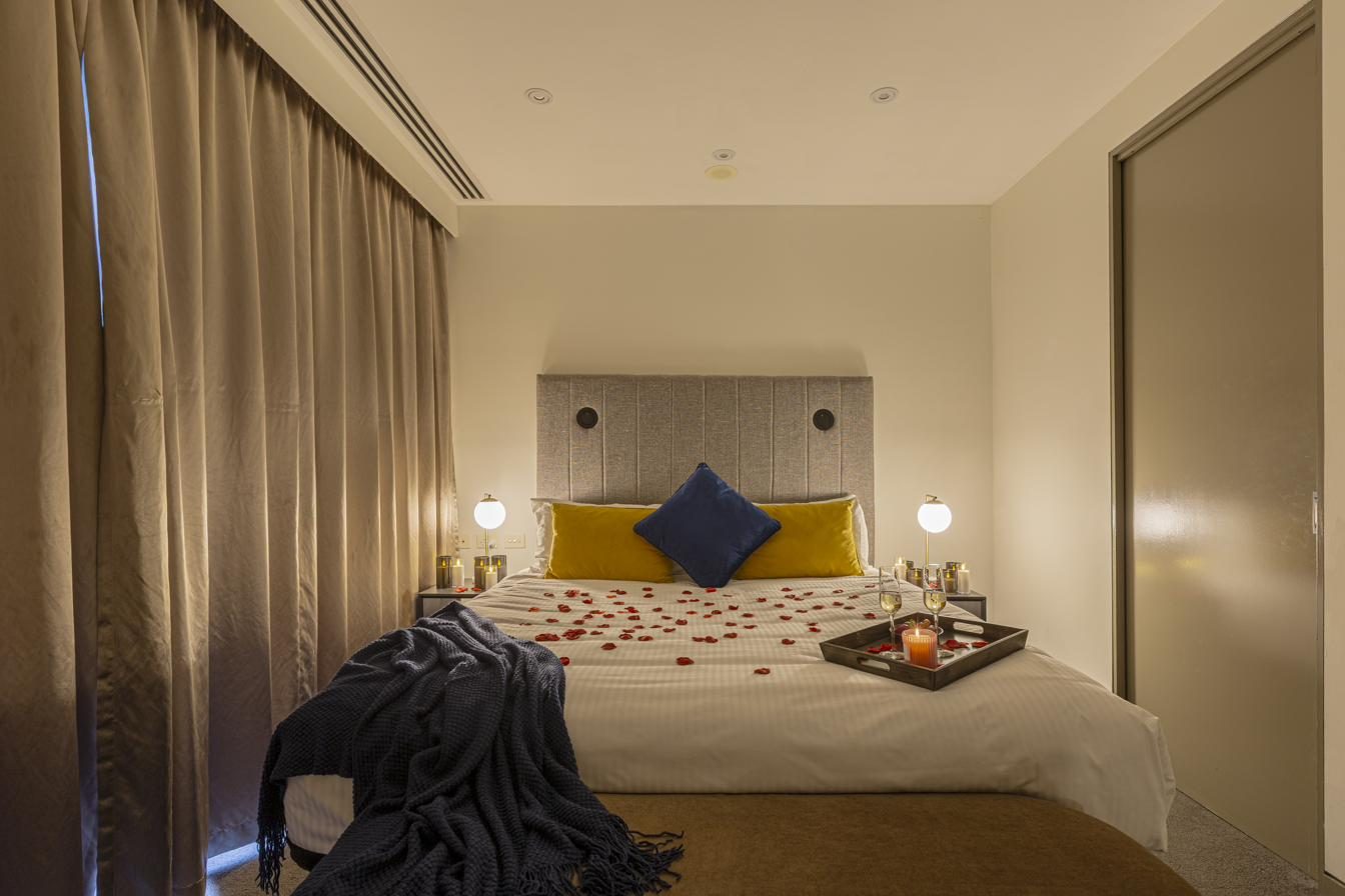 Romantic bedroom with rose petals
